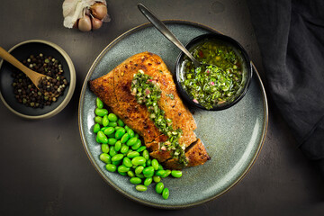 Wall Mural - Grilled pork steak with edamame beans and Chimichurri sauce