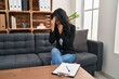 © Krakenimages.com - Young asian woman at consultation office with sad expression covering face with hands while crying. depression concept.