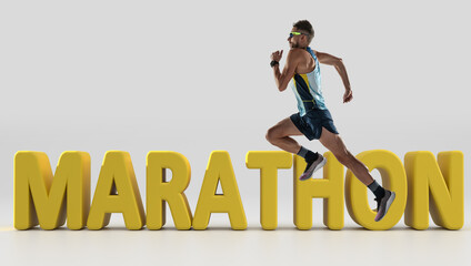 Triathlon male athlete running along 3d lettering Marathon over white background. Concept of healthy lifestyle, sport, action, motion. Side view.