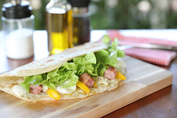 Wall Mural - Italian cuisine , Piadina with sausage and cheese