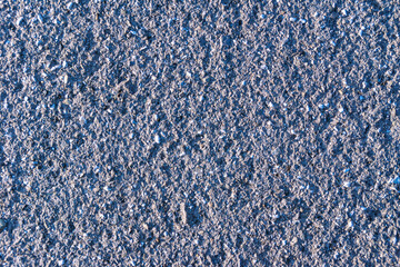 texture of an old pavement with asphalt paved worn by millions of feet