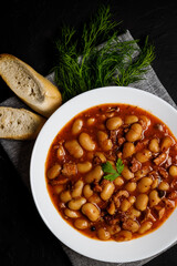 Wall Mural - Tasty polish white baked beans and sausage in tomato sauce