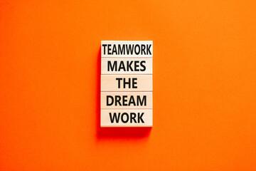 Wall Mural - Teamwork makes the dream work symbol. Concept words Teamwork makes the dream work on wooden blocks on a beautiful orange table orange background. Business Teamwork makes dream work concept. Copy space