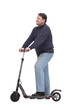 © ASDF - full-length. mature man with an electric scooter.