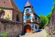 Kaysersberg Vignoble, France. Picturesque street with traditional half timbered houses on the Alsace Wine Route.