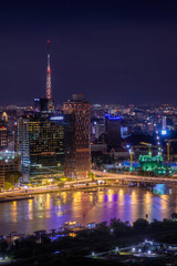 Aerial view of Bitexco Tower, buildings, roads, Thu Thiem 2 bridge and Saigon river in Ho Chi Minh city - Far away is Landmark 81 skyscraper. Travel concept.