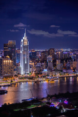 Aerial view of Bitexco Tower, buildings, roads, Thu Thiem 2 bridge and Saigon river in Ho Chi Minh city - Far away is Landmark 81 skyscraper. Travel concept.