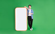 © 1112000 - full body image of asian man standing next to big smartphone, isolated on blue background