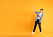 © Q88 - full body image of asian man posing on yellow background