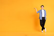 © 1112000 - full body image of asian man posing on yellow background