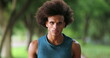 © Marco - Portrait of handsome young black african man walking forward at park outdoor