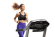 Young woman running on a treadmill