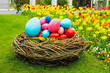 easter concept. basket with Easter eggs on the grass. against the backdrop of beautiful nature. tulips. spring beautiful bloom of nature.