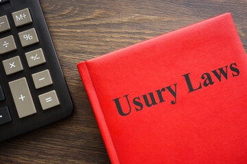 Usury laws book near a dark calculator.