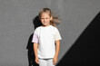 © Ruslan Ivantsov - little girl in white t-shirt. space for your logo or design.