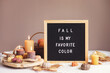 Felt letter board and text Fall is my favorite color. Autumn table decoration. Floral interior decor for fall holidays with handmade pumpkins.