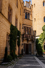  Burg Hohenzollern, Baden-Wurttemberg, Germany, 5 July 2022: medieval knights castle with towers in English Gothic Revival architecture, monument to Romanticism, old fortifications on hill at sunny day