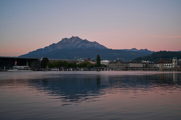 Sticker - City near sea against mountains at sunset