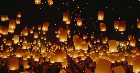 amazing sky lanterns lifting up into the night sky, world travel and adventure, fire lanterns at the