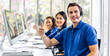 © Art_Photo - Group of happy call center smiling business operator customer help support team phone services agen working and talking with headset on desktop computer at call center office