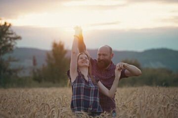 Sticker - Loving couple in a wheat field.