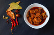 selective focus of delicious Indian style mutton curry with a decorative background. 