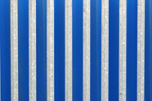 Unpainted Steel Security Fence Seen Against Blue Background 