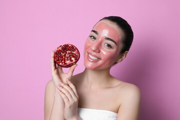 Canvas Print - Woman with pomegranate face mask and fresh fruit on pink background