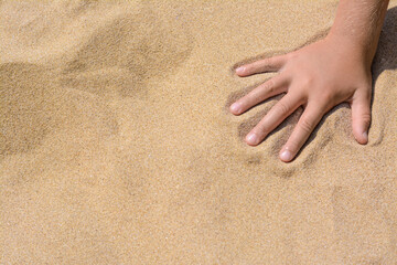 Wall Mural - Child leaving handprint on sand outdoors, closeup with space for text. Fleeting time concept