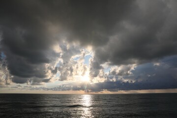 Wall Mural - picturesque view of sky with heavy rainy clouds over sea