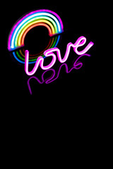Wall Mural - Image of vibrant neon love text and glow sticks forming rainbow over black background and copy space