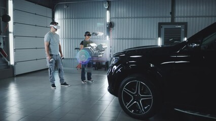 Wall Mural - two technicians check a car engine using virtual reality technology in a workshop. experts discuss t