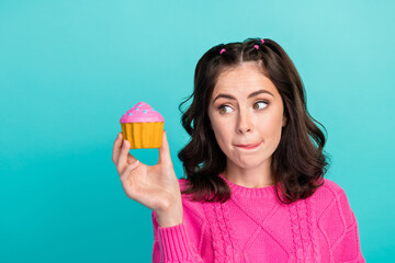 Poster - Portrait of gorgeous sweet woman tails hairstyle wear pink jumper staring at cupcake tongue lick lips isolated on teal color background