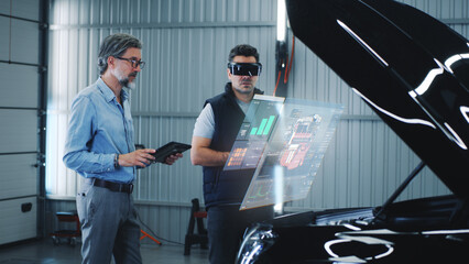 Wall Mural - two specialists carry out car diagnostics using modern tools. they study the indicators and graphs o