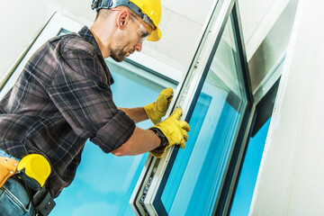 Wall Mural - Contractor Installing the Window