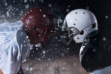 Two American Football Players Face To Face In Silhouette Shadow On White Background
