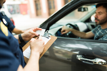 Poster - Police agent making a speeding ticket for a driver