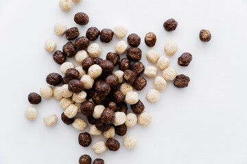 Canvas Print - top view of cereal balls with chocolate and vanilla flavors isolated on white.