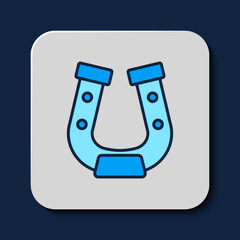 Poster - Filled outline Horseshoe icon isolated on blue background. Vector