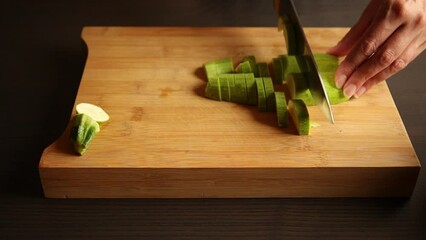 Wall Mural - cutting zucchini on wooden chopping board