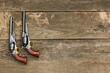 Two most famous Black powder revolvers Colt Army and Remington New Army on an old board background
