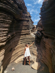 tourist visiting the volcanic rocks