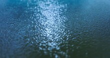 Water Surface With Tilt Shift Effect Waves From A Lake, Sea, Ocean Or River For Background Texture. Blue Water Waves. Ripples On The Surface Of Water