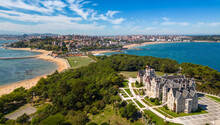 Magdalena Palace In Santander Spain With Aerial View Of The Peninsula And The City With Sunny Beach In Summer.