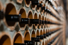 Archive Of Red Wine With Black Corks In The Wine Cellar In Special Brick Openings. Bela Krajina, Slovenia