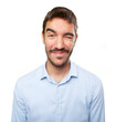 © agongallud - Close up of a young man winking an eye
