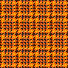 Wall Mural - Goose foot. Halloween Pattern of crow's feet in orange, black and yellow cage. Glen plaid. Houndstooth tartan tweed. Dogs tooth. Scottish cage. Seamless fabric texture. Vector illustration