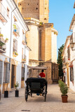 Fototapeta Na drzwi - Carriage with tourists next to the Church of Santa Maria la Mayor in the historic center of Ronda, Malaga