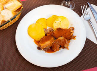 Poster - Sliced juicy pork meat served with potato and sauce, comfort meal