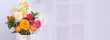 Vase with beautiful ranunculus flowers on blurred background, space for text. Banner design